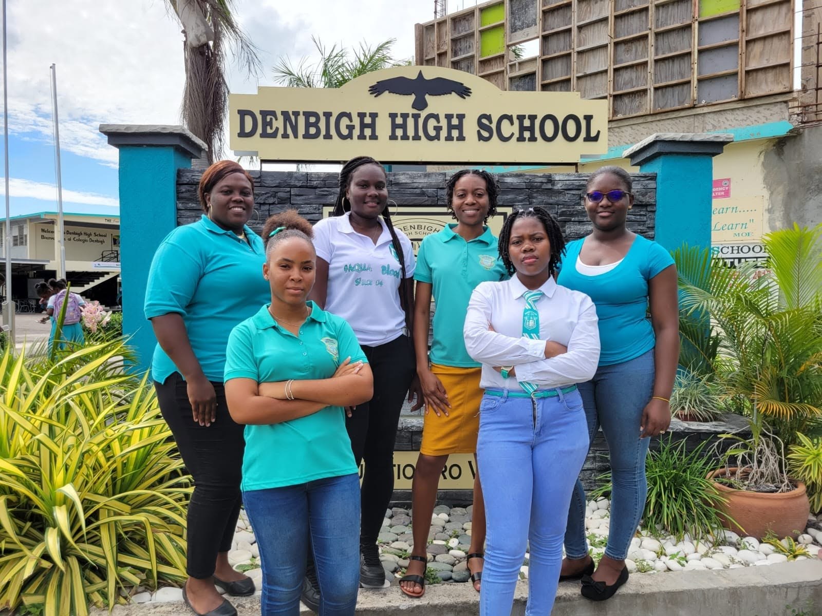 Members of the Denbigh community at the Denbigh High School entrance